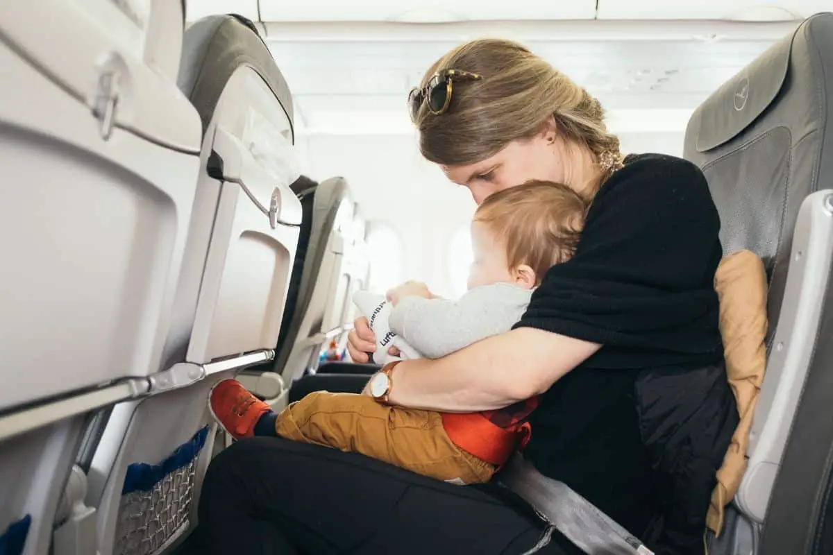mom and baby flying in an airplane