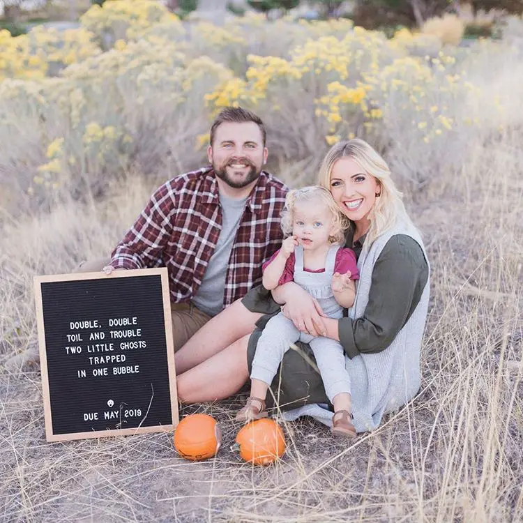 twin pregnancy reveal with letter board