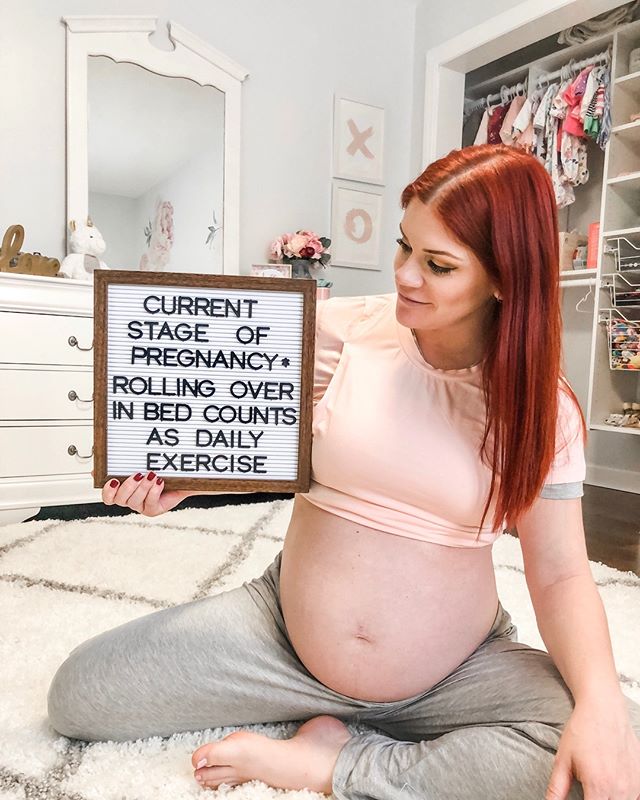 Letter board that says "Current Stage of Pregnancy rolling over in bed counts as daily exercise"
