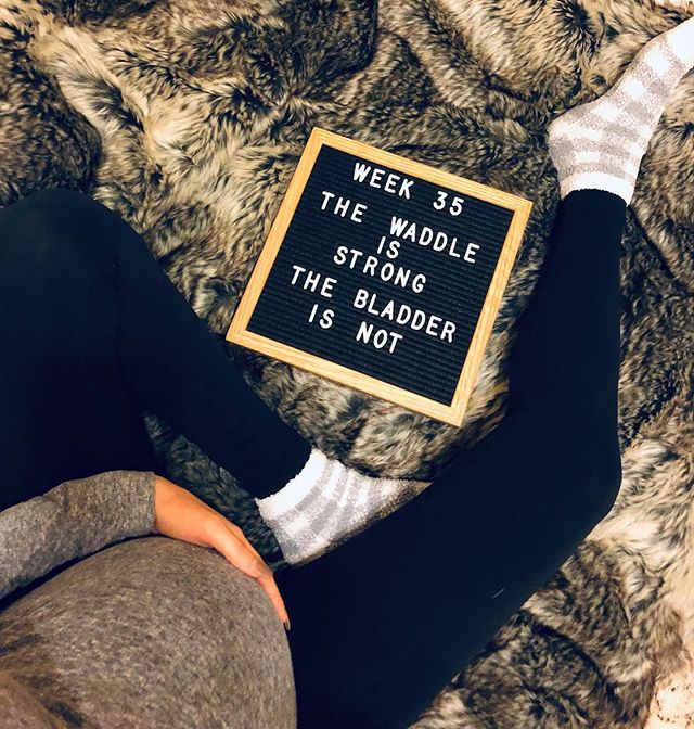 A letter board that says "Week 35 the waddle is strong, the bladder is not"