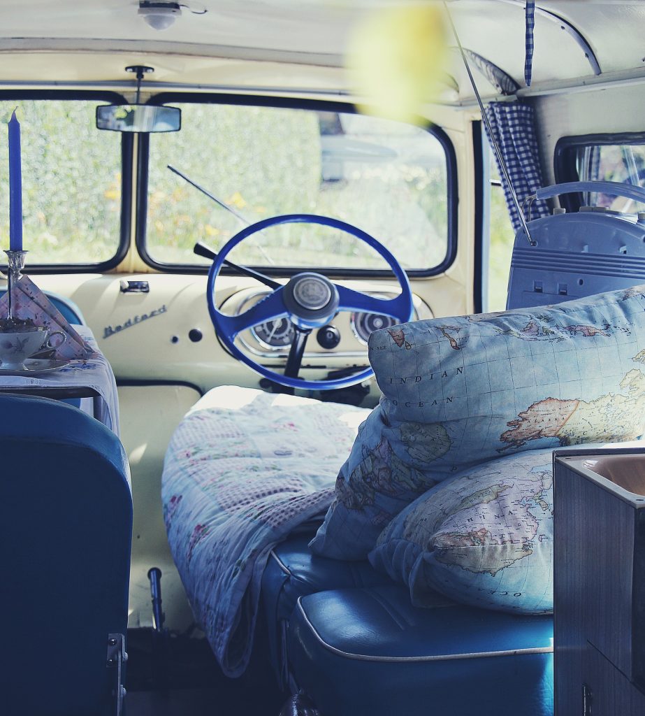 The inside of a vintage RV, facing the dashboard