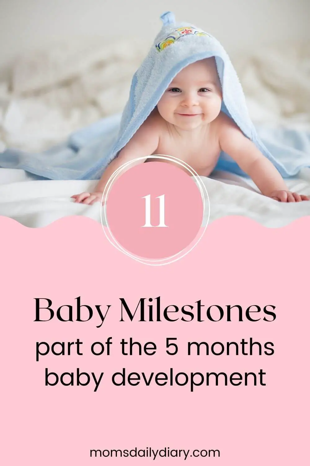 Pin image with text 11 Baby Milestones part of the 5 months baby development and image of a baby smiling during tummy time and covered with a towel.