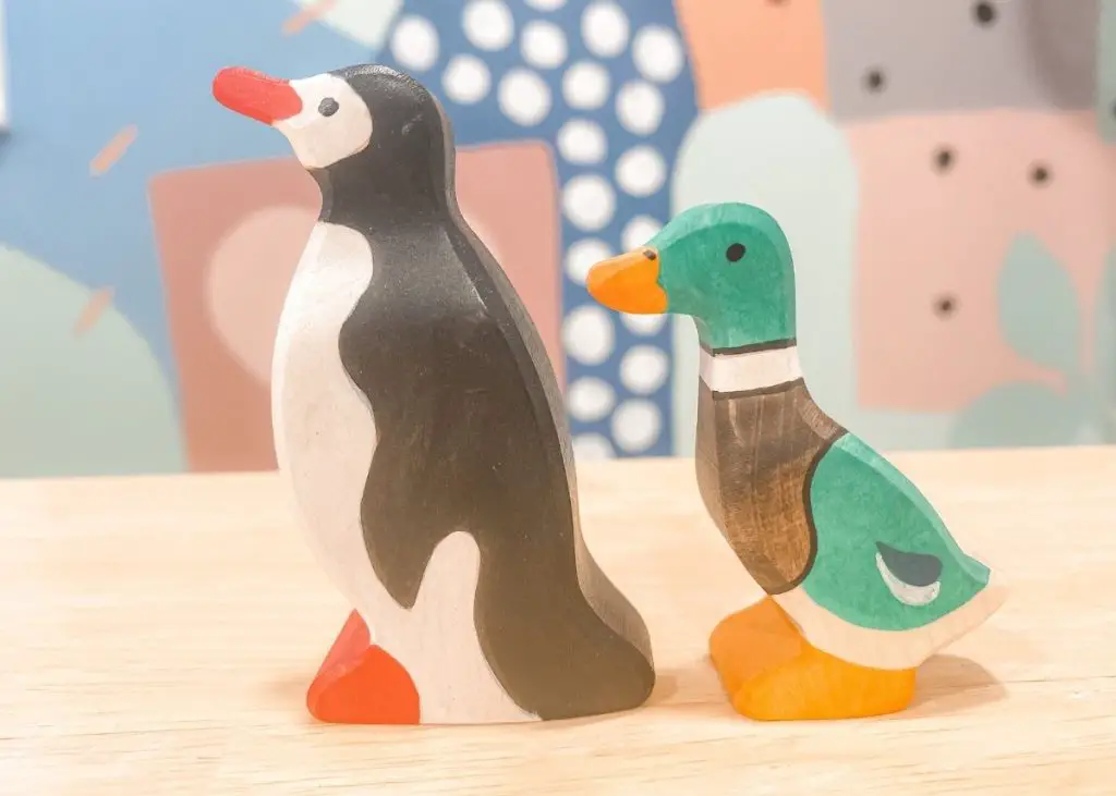 Holztiger duck and penguin