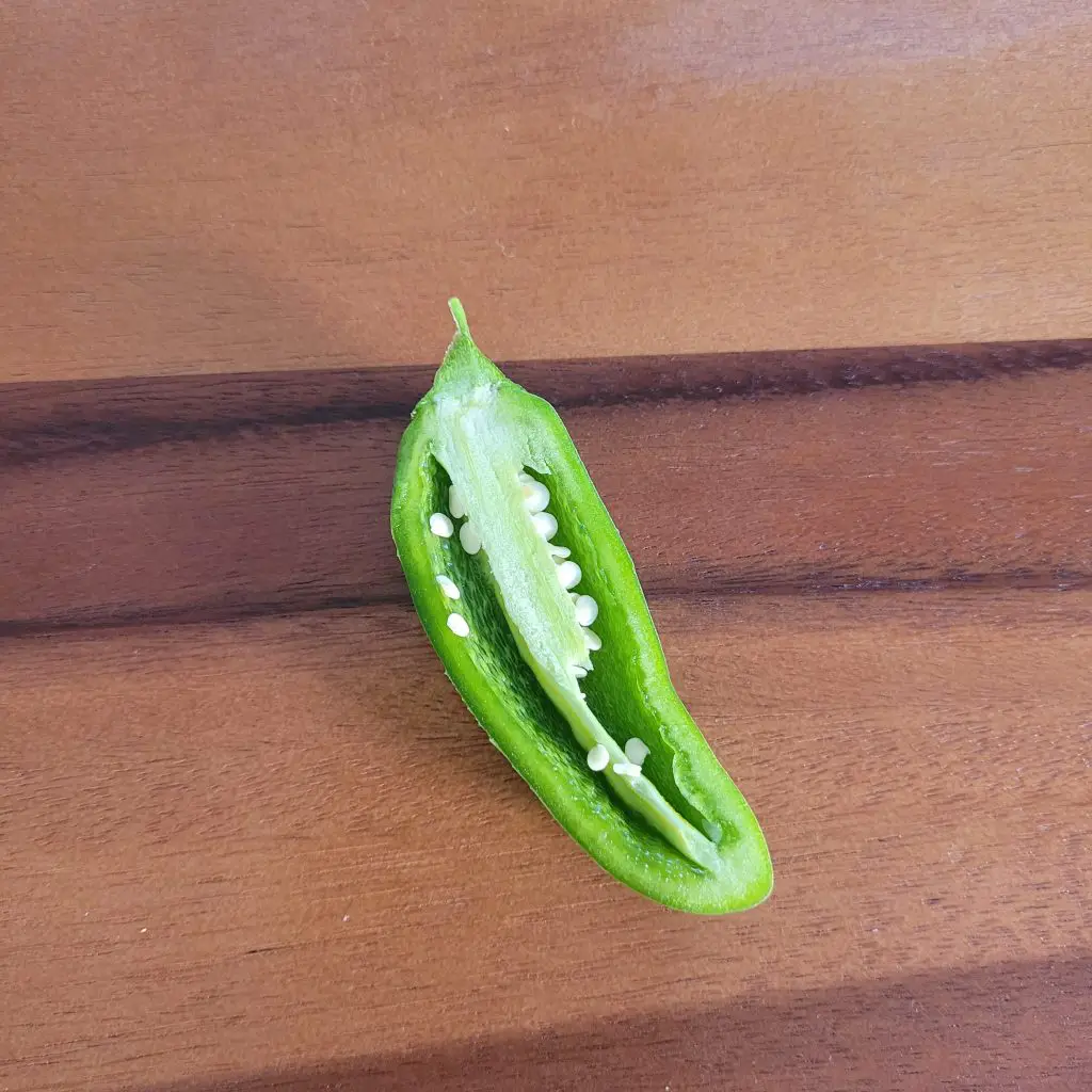 remove the seeds of a jalapeno to make it less hot