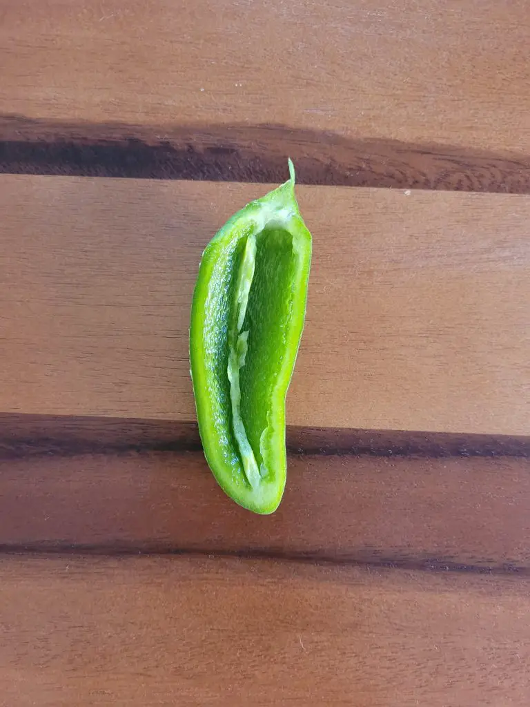 remove the seeds of a jalapeno to make it less hot
